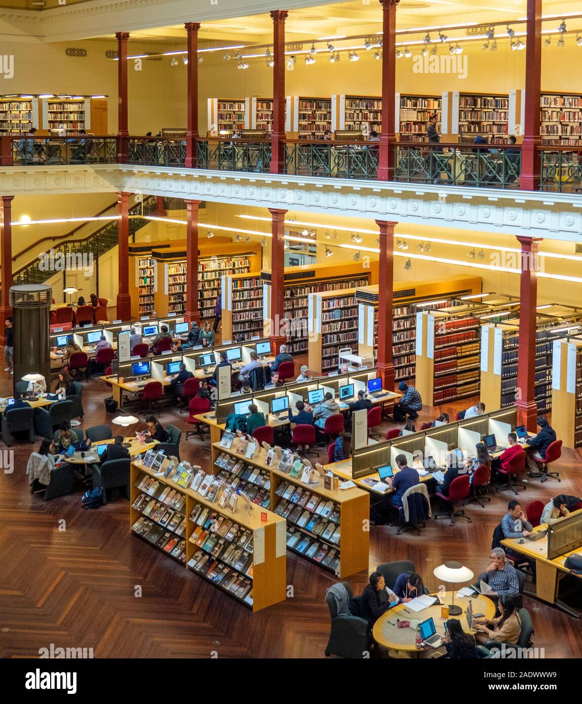 Students studying in Redmond Barry Reading Room in State Library Victoria Melbourne Australia