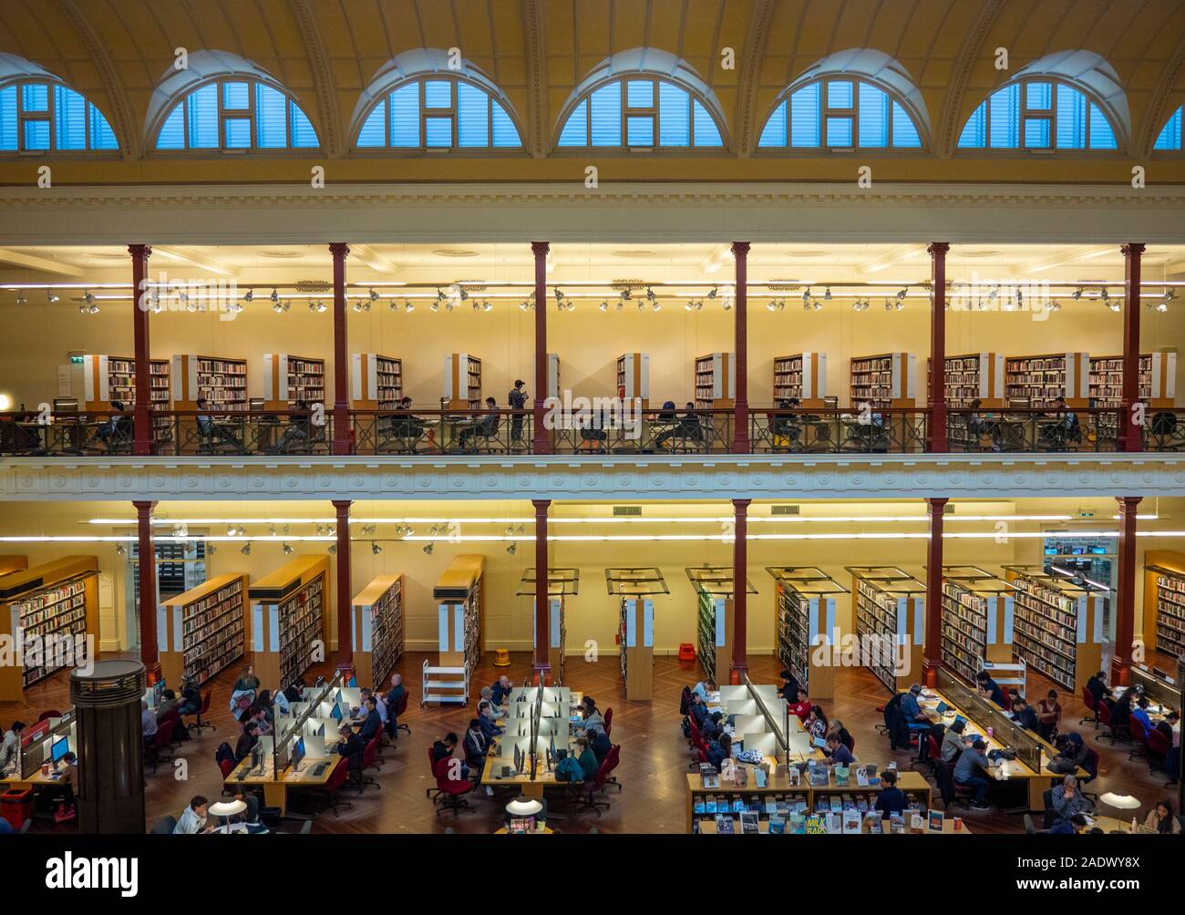 Students studying in Redmond Barry Reading Room in State Library Victoria Melbourne Australia