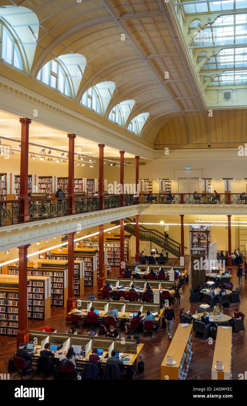 Students studying in Redmond Barry Reading Room in State Library