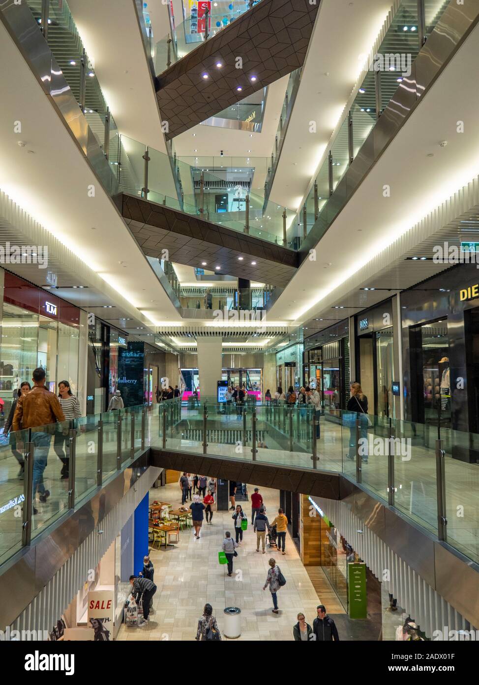 Underside of pedestrian bridges across multiple levels in atrium in Emporium Melbourne shopping