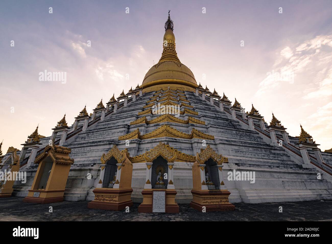 Bago, Myanmar - February 05, 2018: Mahazedi Pagoda at sunset - this is one of the most prominent Buddhist temples in Bago. Stock Photo
