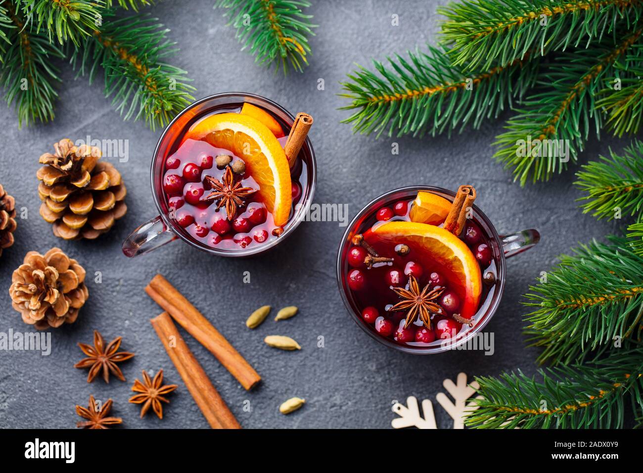 Mulled red wine with spices. Christmas decoration. Grey background. Top view Stock Photo