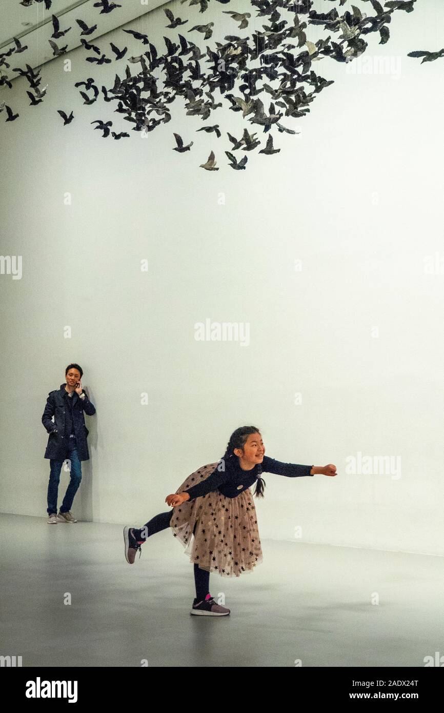 Girl posing for photo at Murmuration (Landscape) installation at National Gallery of Victoria NGV  Melbourne Victoria Australia. Stock Photo