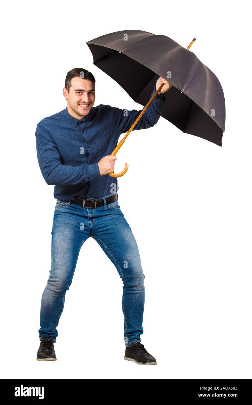 Full length of cheerful businessman hiding behind his open umbrella as