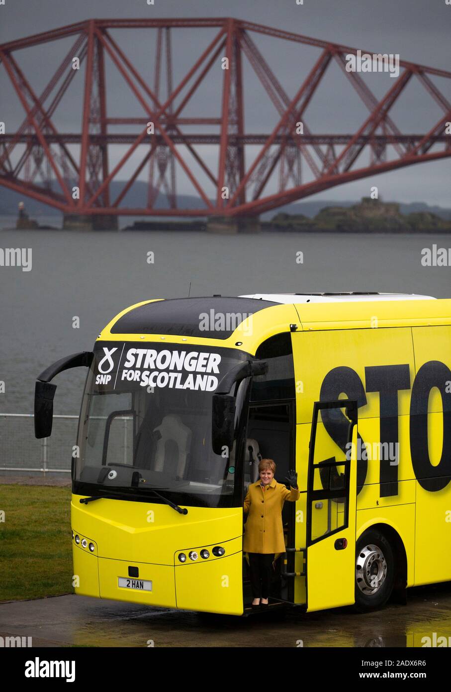 SNP leader Nicola Sturgeon with the SNP campaign bus in front of the Forth Bridge, while on the General Election campaign trail in Scotland. Stock Photo