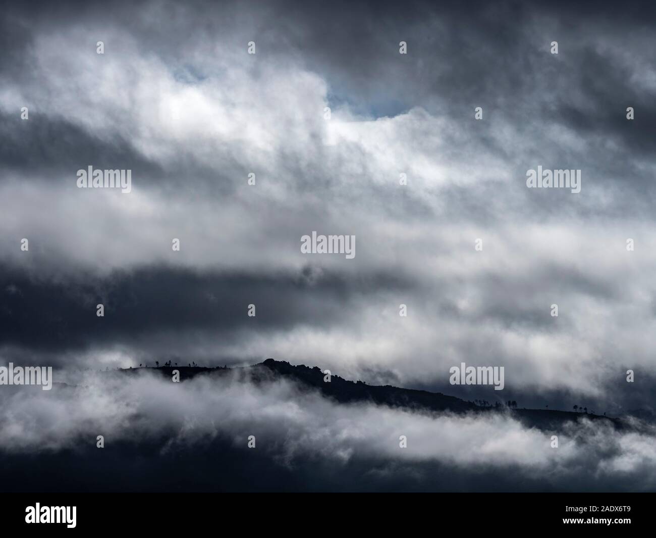 Epic mountainous landscape with dramatic weather conditions and lighting Stock Photo