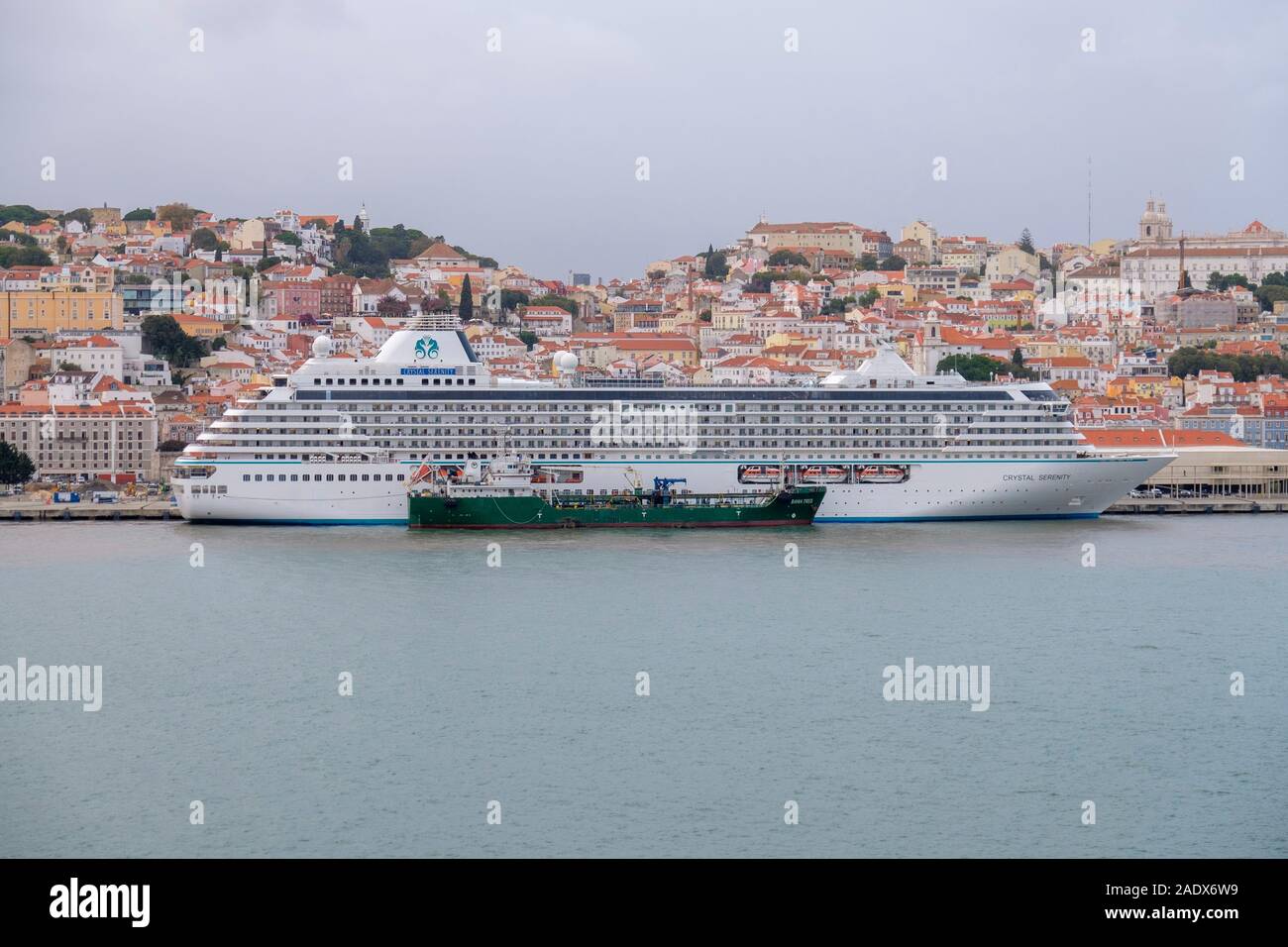 Oil tanker refueling the Crystal Serenity cruise liner ship at the port of Lisbon, Portugal, Europe Stock Photo