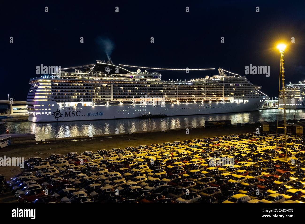 Nighttime view of the MSC Preziosa cruise liner ship docked at the port of Barcelona, Spain, Europe Stock Photo