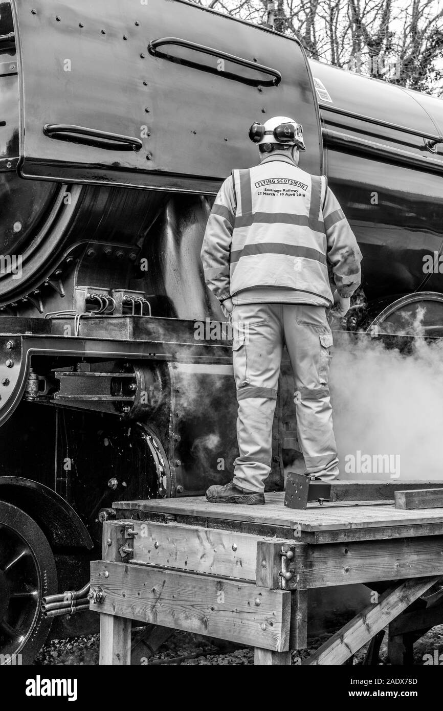 Staff check alongside to famous Flying Scotsman, UK Stock Photo