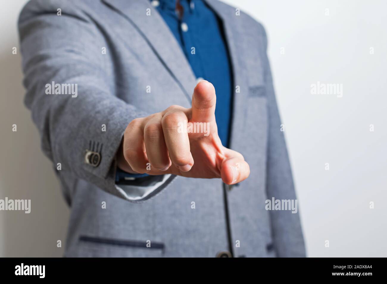 Man in suit pointing with his finger. Stock Photo