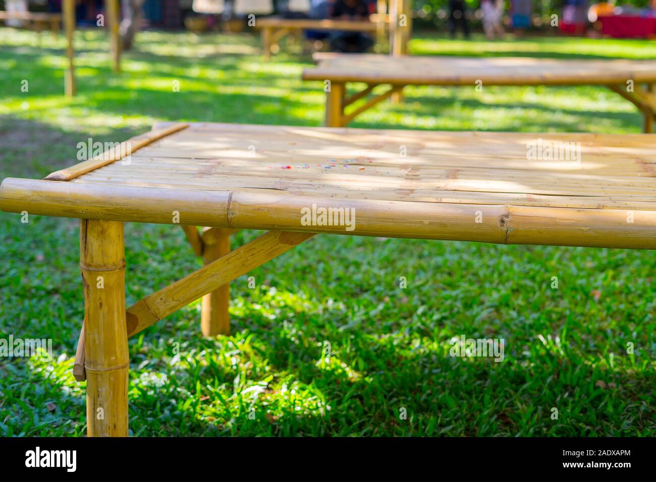 Bamboo bench, Bamboo carriage in the green grass, made of strong and durable for use Stock Photo
