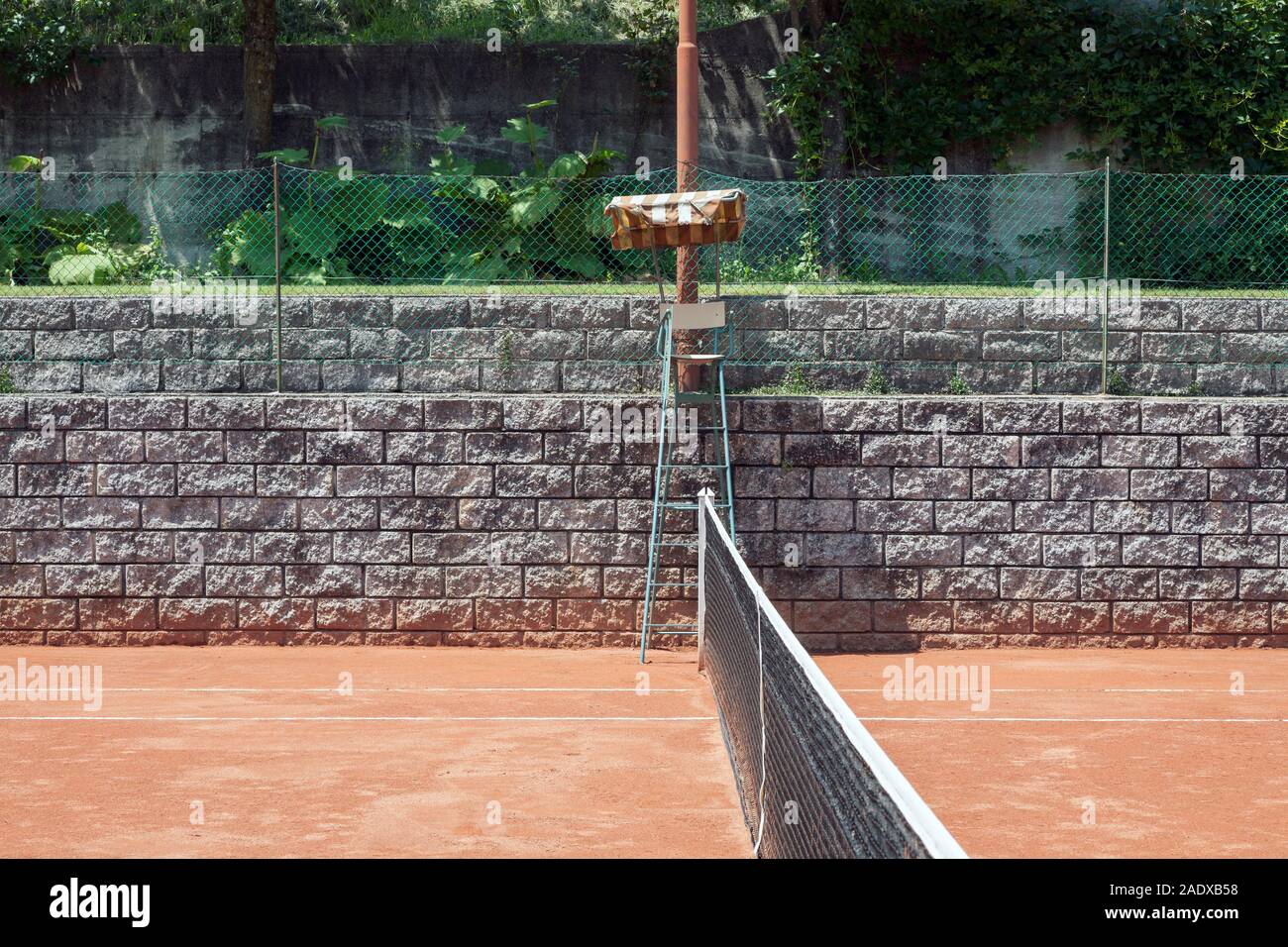 red clay tennis court in a mountain resort area Stock Photo Alamy