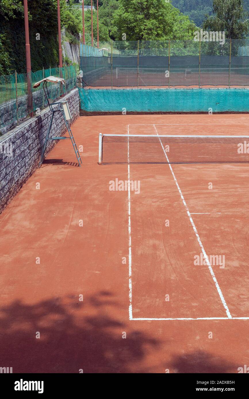 red clay tennis court in a mountain resort area Stock Photo Alamy