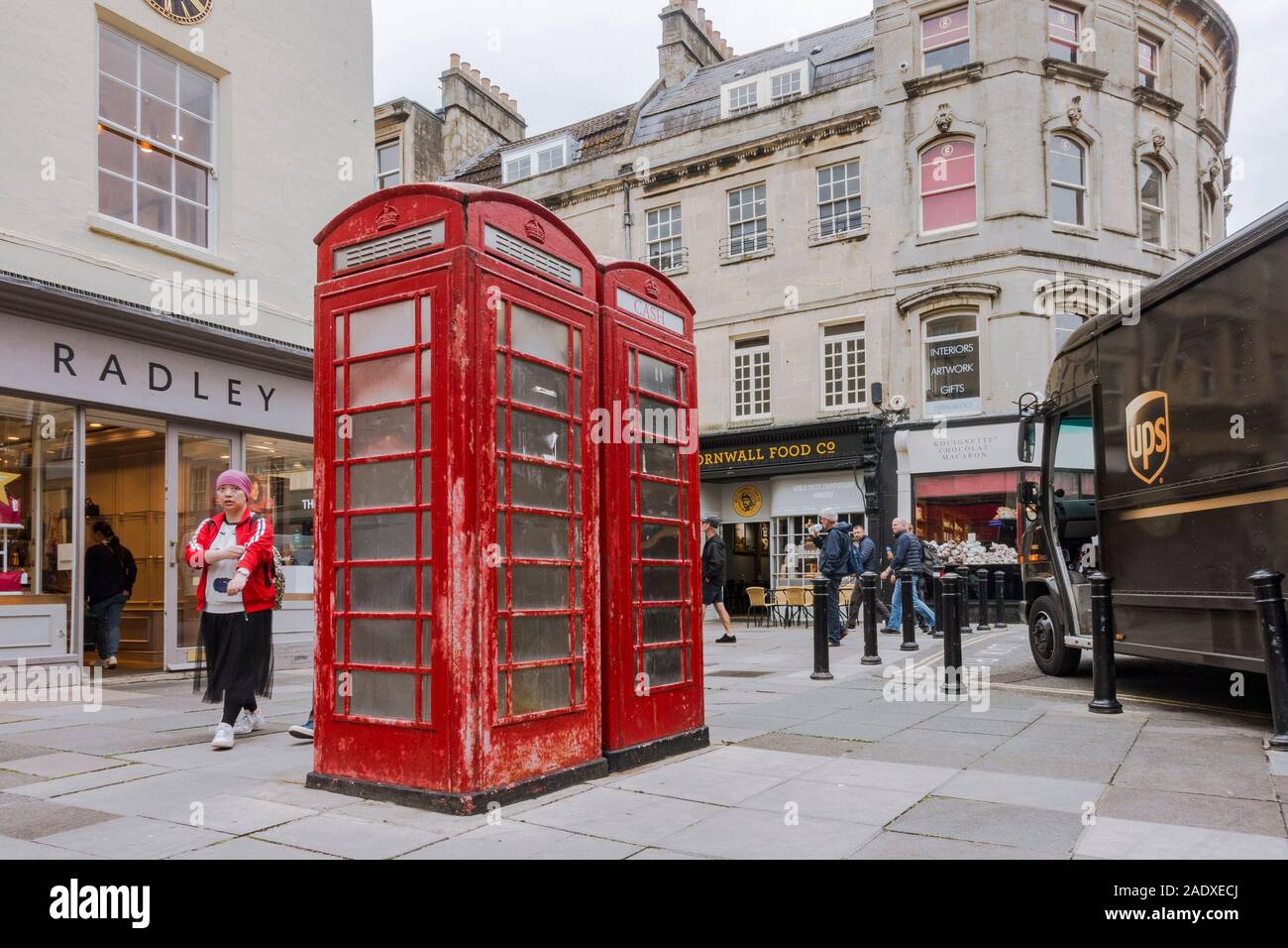 Traditional British red phone boxes, now used as ATM , Cash machines, financial transactions. Bath, Somerset, England, UK. Stock Photo