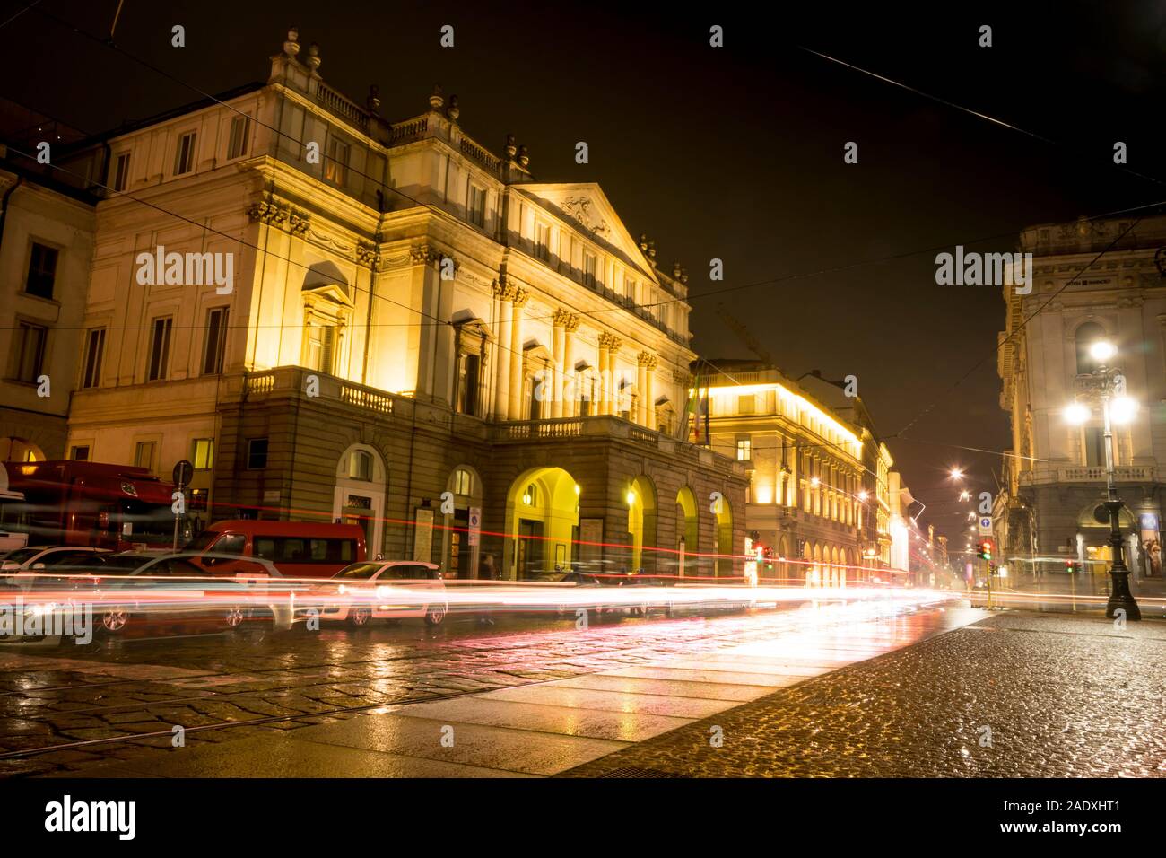 Teatro alla Scala (Theatre La Scala) at night in Milan, Italy. Light trails of car traffic. Stock Photo