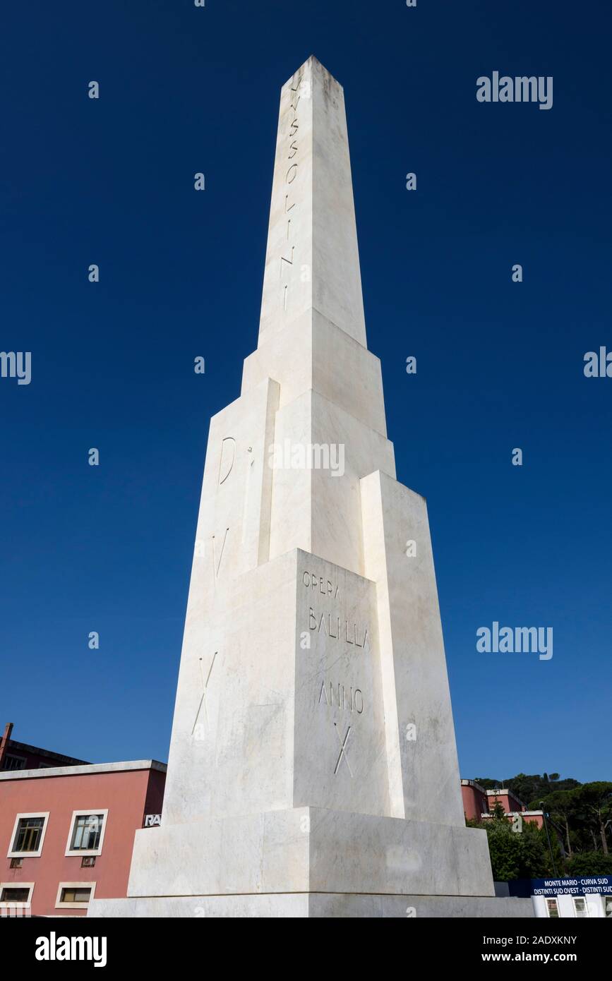 Rome. Italy. Obelisk at the entrance to the Foro Italico, bearing the insciption 'Mussolini Dux'.  The monument was created after an offer of a giant Stock Photo