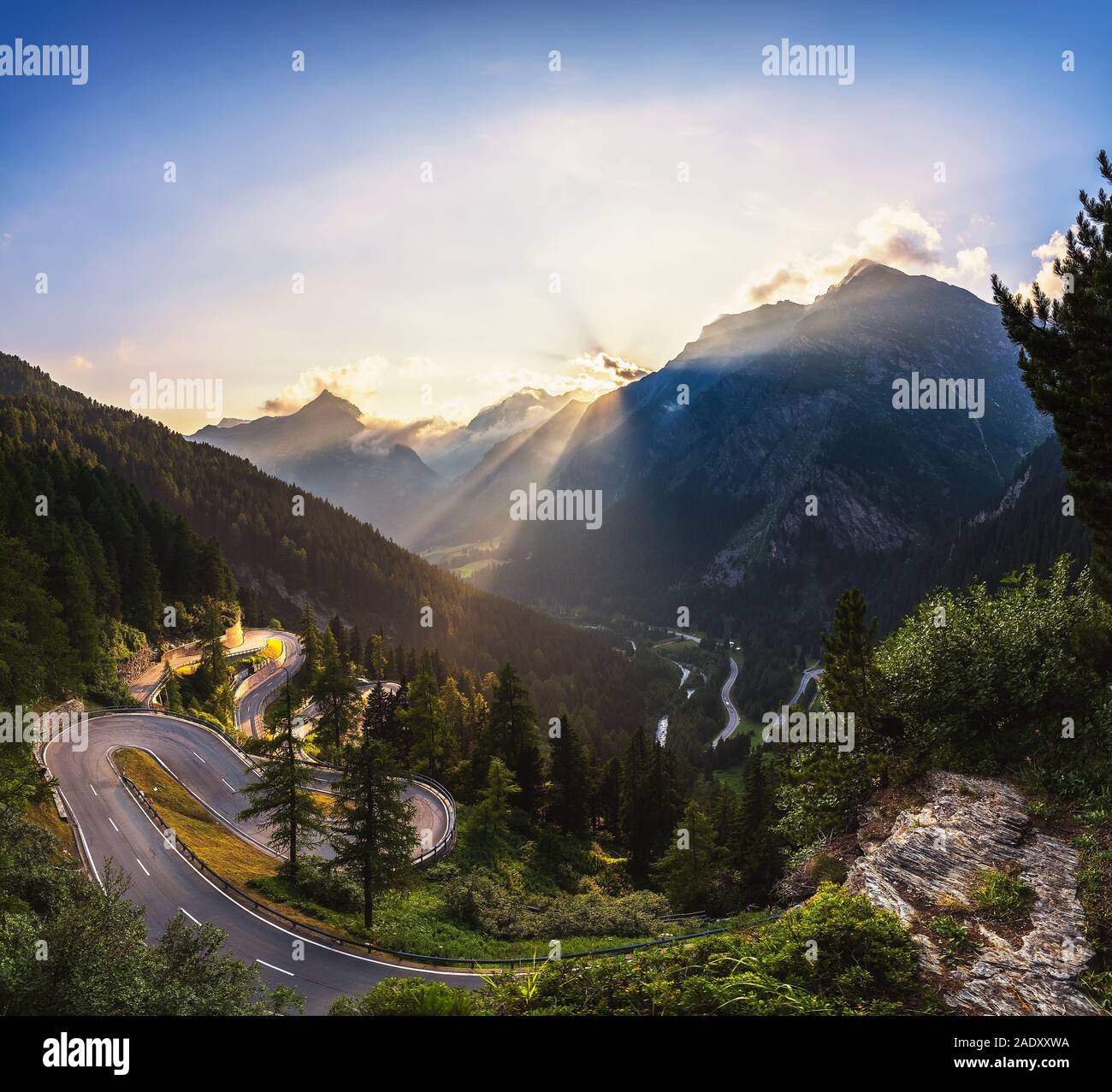 Aerial view of Maloja Pass road in Switzerland at sunset. This Swiss Alps mountain road is located in dense forests of the canton Graubunden. Hdr proc Stock Photo