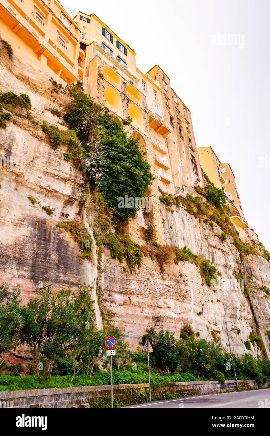 Famous sea promenade in Tropea with high cliffs with built on top city buildings and apartments. Overgrown with southern plants rocks as strong founda Stock Photo