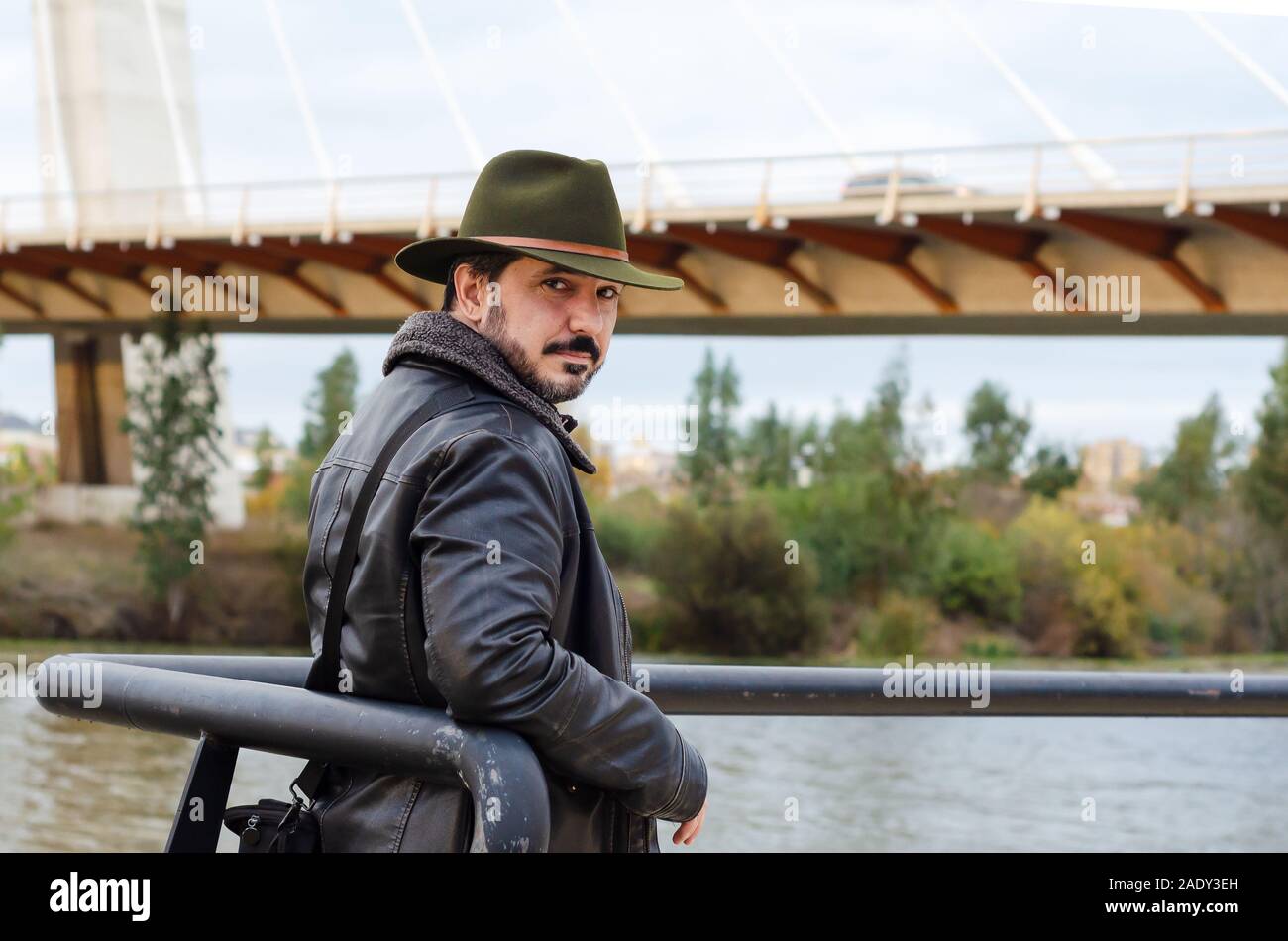 man with jacket and hat in the street Stock Photo