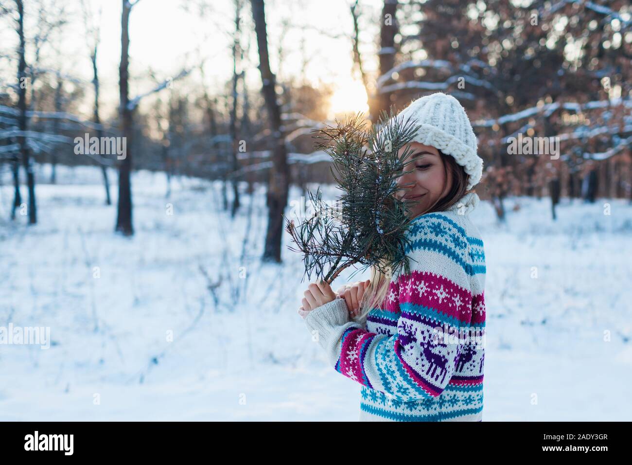 Full body portrait of young woman walking in snowy winter park wearing blue  coat, knitted warm clothes. Female fashion for cold weather Stock Photo -  Alamy