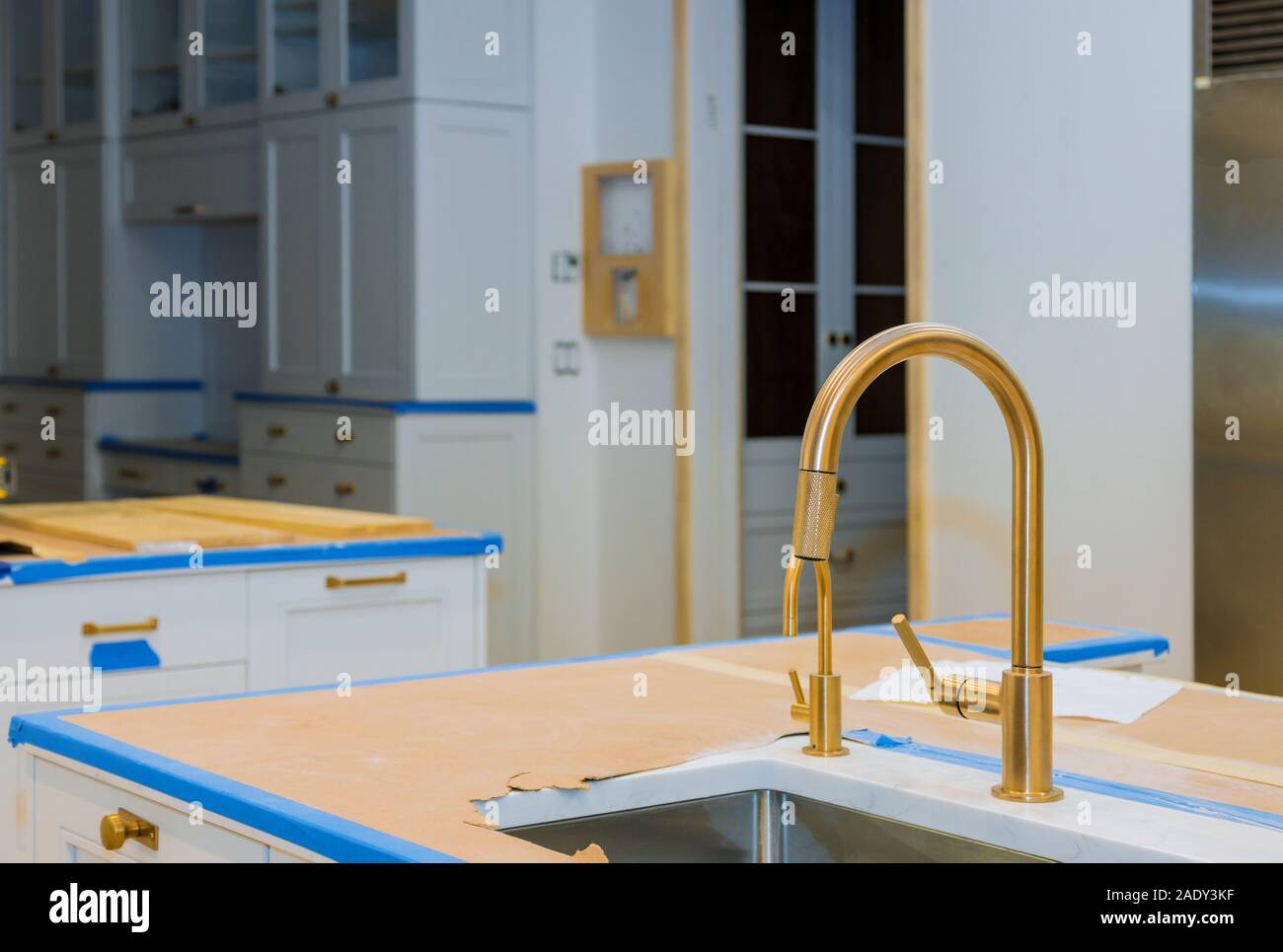 Modern domestic kitchen cabinets with new appliances and sink in ...