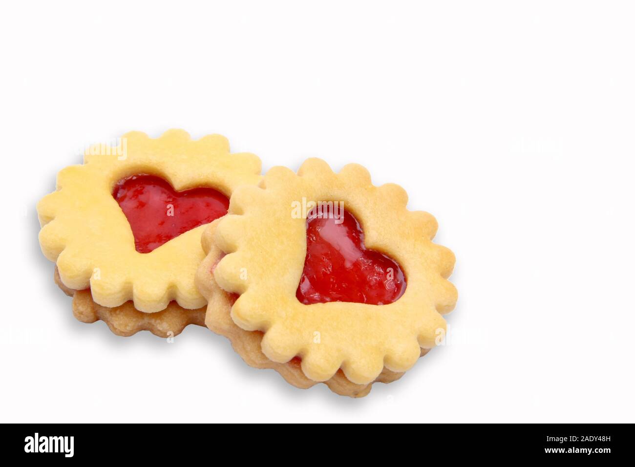 Cookies with red jam, isolated Stock Photo Alamy