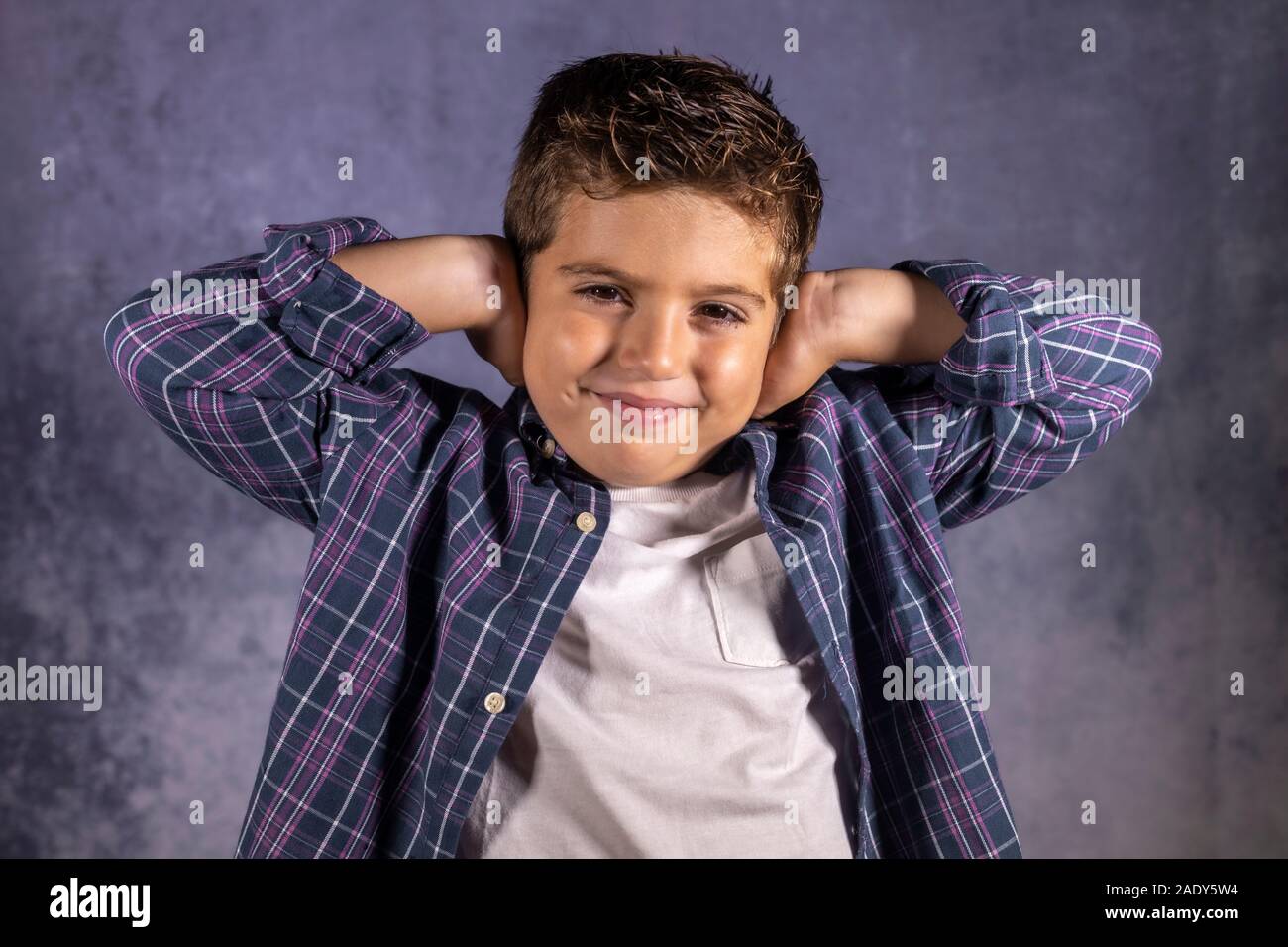 Little child covering his ears with his hands Stock Photo Alamy