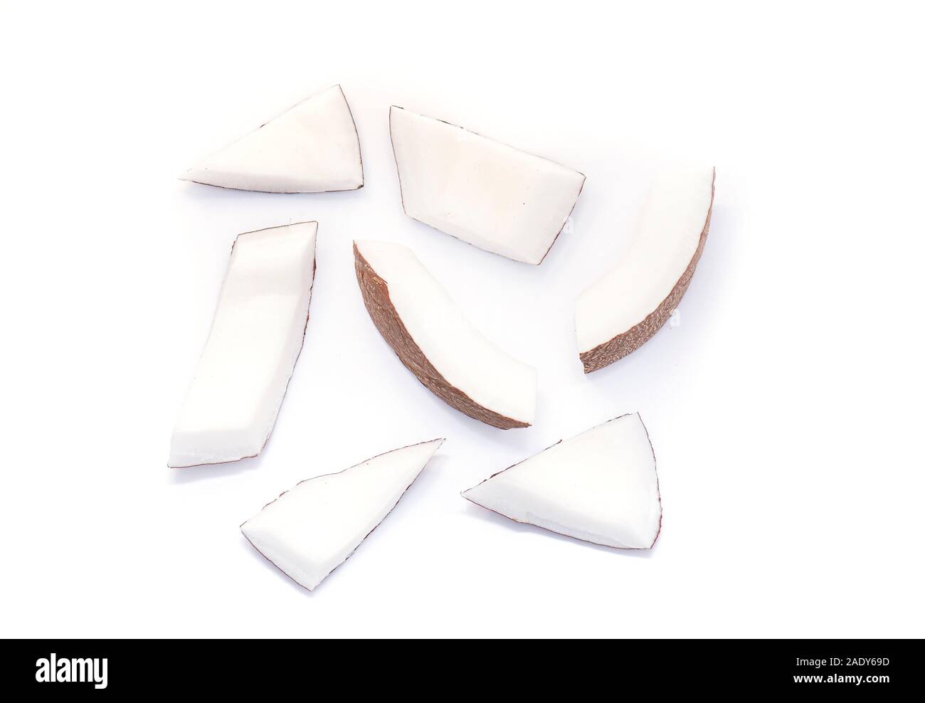 Coconut Pieces, Cut Coconut isolated on colored Background Stock Photo