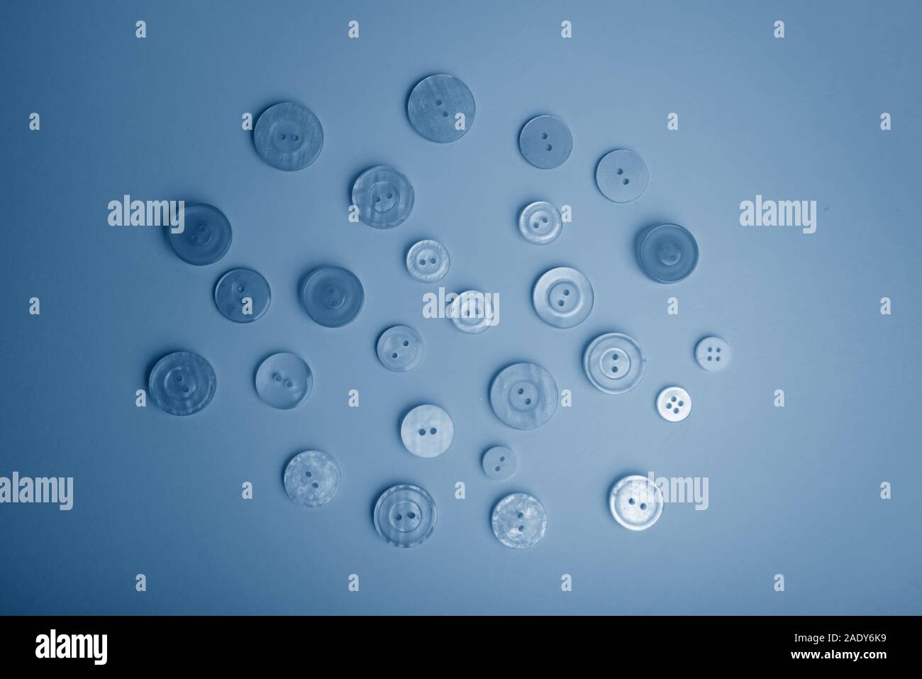 Buttons of different colors in blue tones. Flat lay Stock Photo Alamy