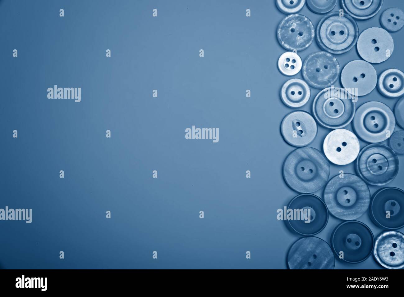 Buttons of different colors in blue tones. Flat lay Stock Photo - Alamy