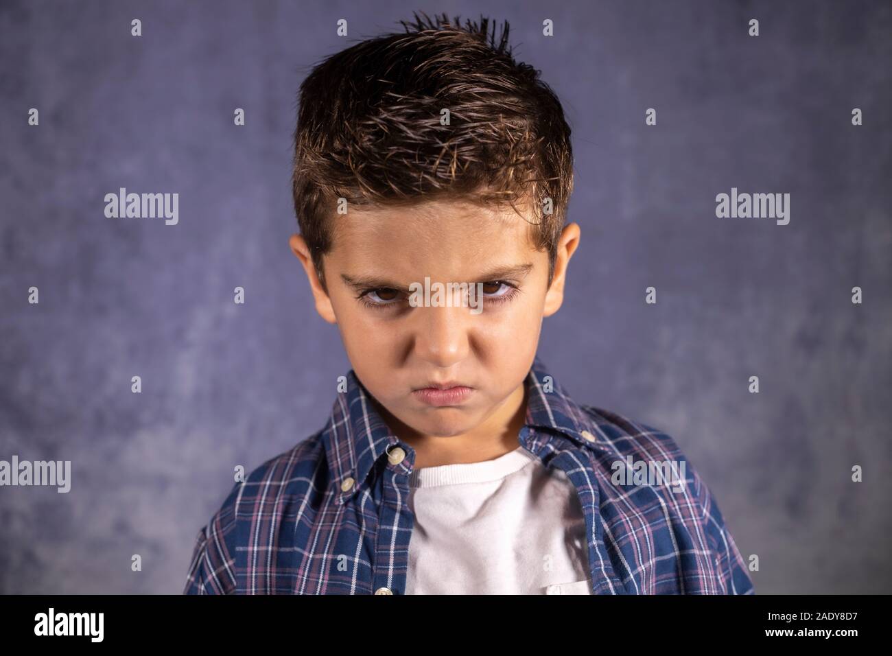 Angry child. Little boy with an angry expression Stock Photo - Alamy