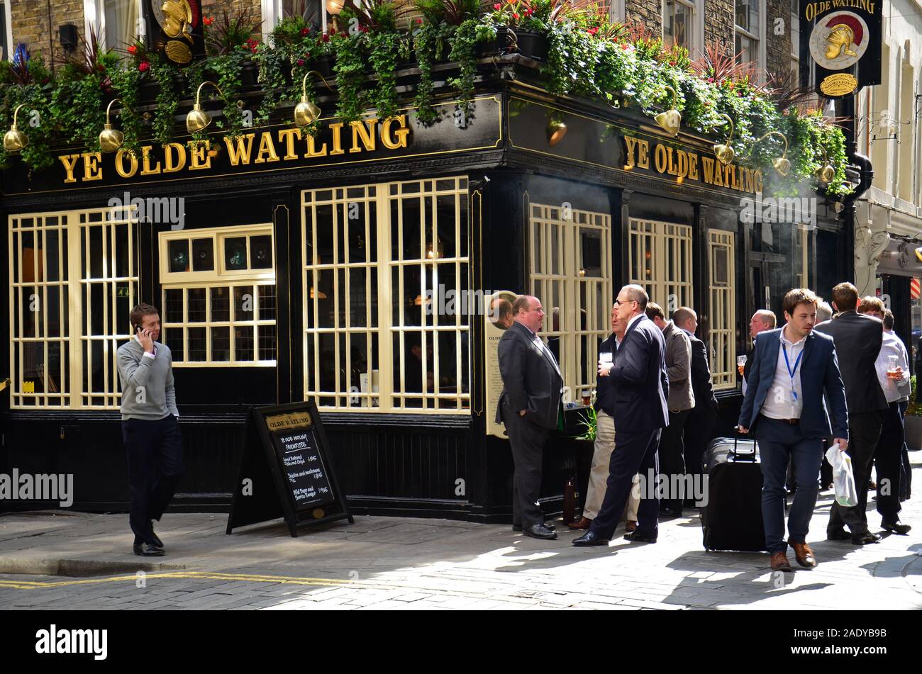 April 2, 2019- London, England, UK - Office workers at lunchtime outside the Ye Olde Watling pub Stock Photo