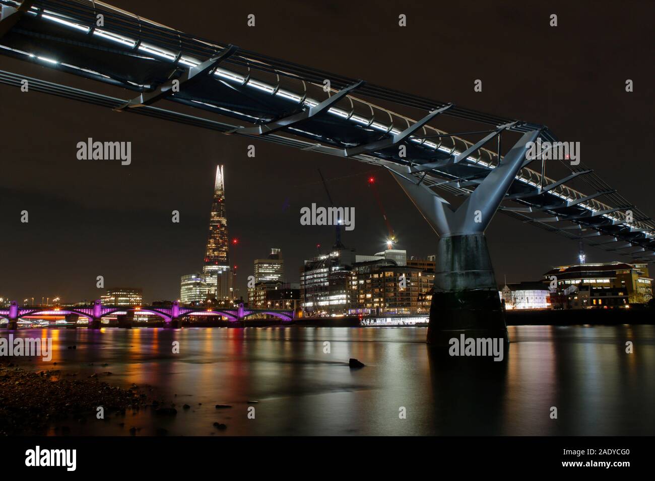 The Millennium Bridge and The Shard at night, London UK Stock Photo