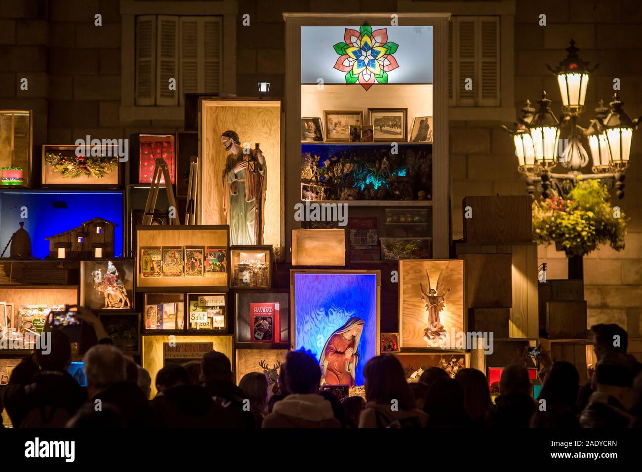 Barcelona, Catalonia, Spain. 5th Dec, 2019. People contemplates the traditional Christmas Nativity Scene in Barcelona downtown. This year the installation of the Christmas nativity scene of the Catalan capital consists on several compartments or boxes where religious characters and Christmas motifs are placed. Credit: Jordi Boixareu/ZUMA Wire/Alamy Live News Credit: ZUMA Press, Inc./Alamy Live News Stock Photo