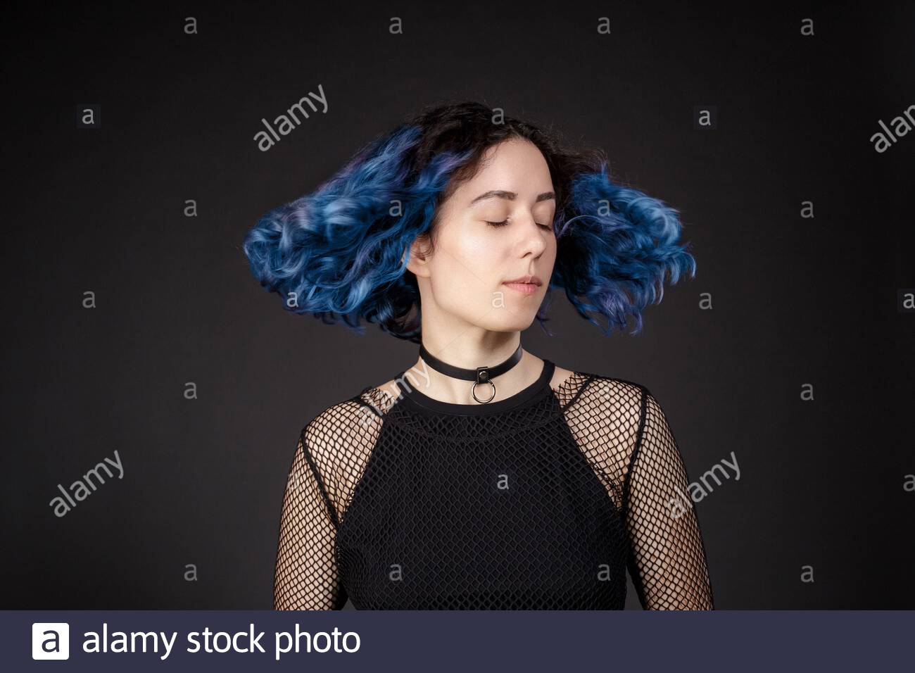 Gothic Girl Looks To Side On Dark Background With Blue Hair