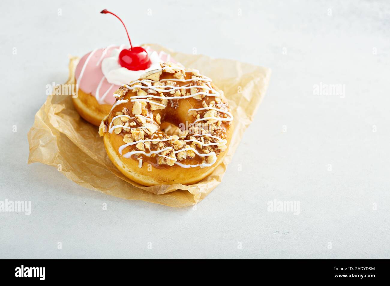 Sweet caramel and cherry glazed donuts Stock Photo Alamy