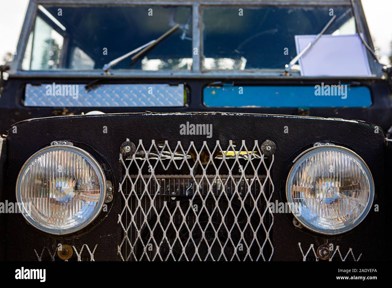 Circle lights lamps headlights on the car steel front, with Metal mesh as a radiator grille with