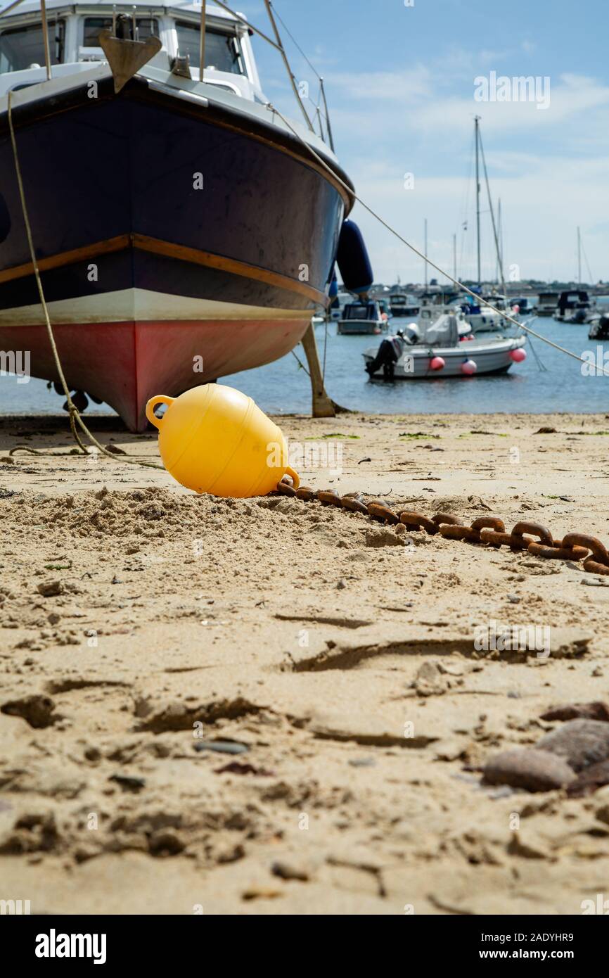 Boats on the beach waiting for high tide, Jersey Channel Islands Stock Photo