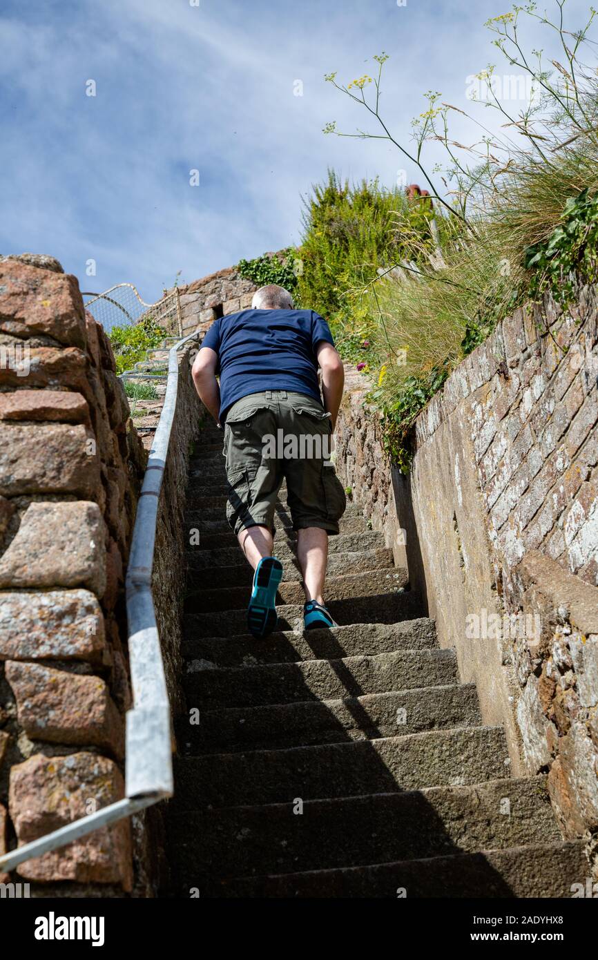Running up the stairs on a summers day Stock Photo