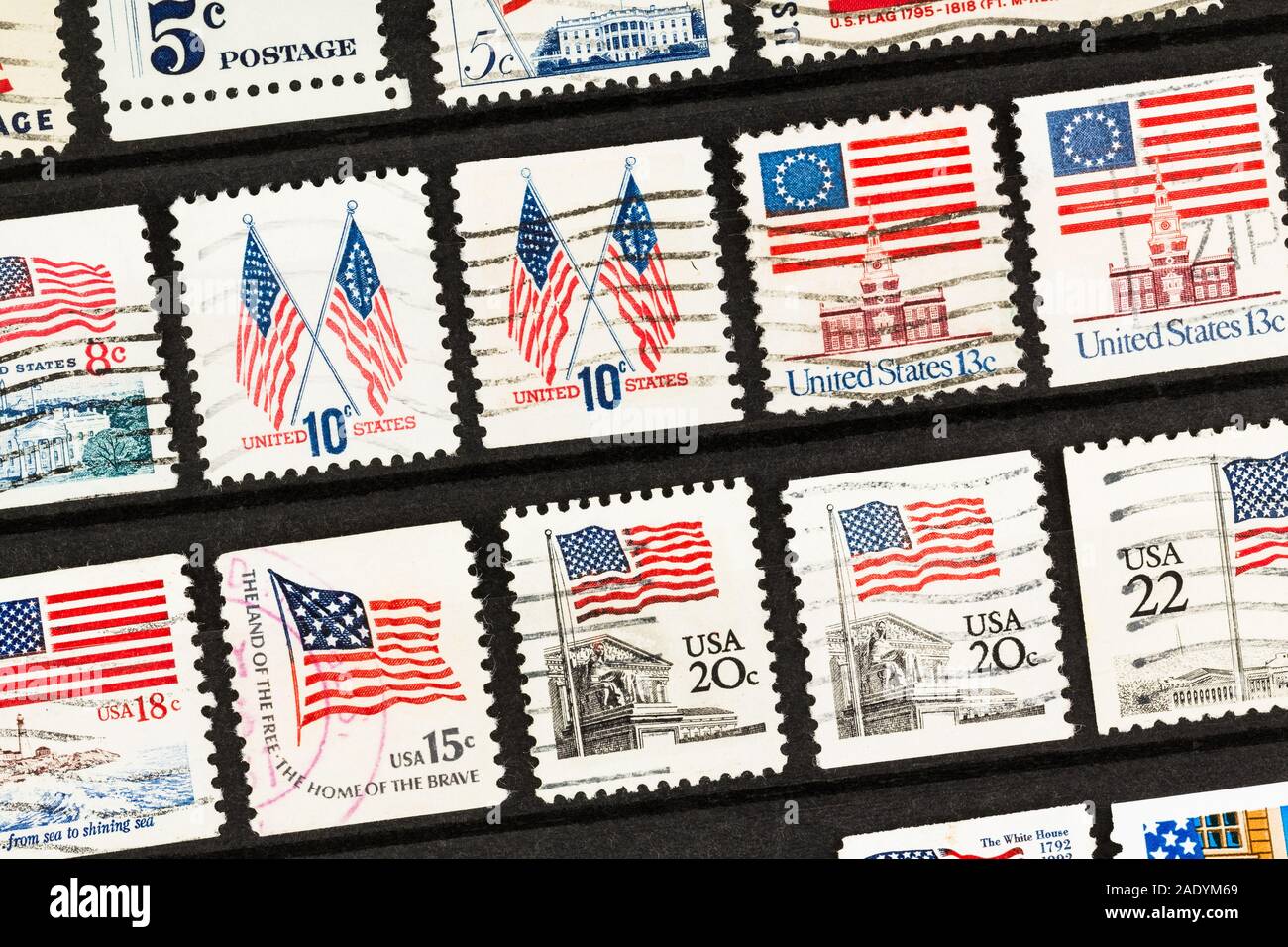 SEATTLE WASHINGTON - November 28, 2019:  Rows of old used United States postage stamps on an angle in stock book. Stock Photo