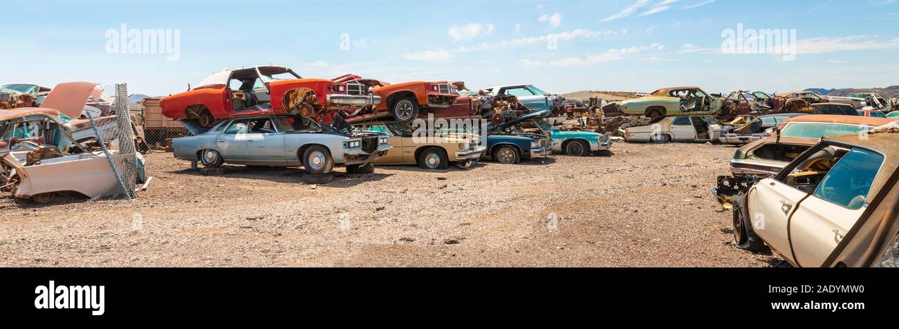 panorama view of 1960s american cars in a desert junkyard near Phoenix arizona Stock Photo