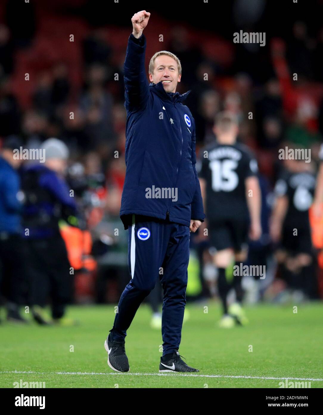 Brighton and Hove Albion manager Graham Potter celebrates the results at the end of the Premier League match at the Emirates Stadium, London. Stock Photo