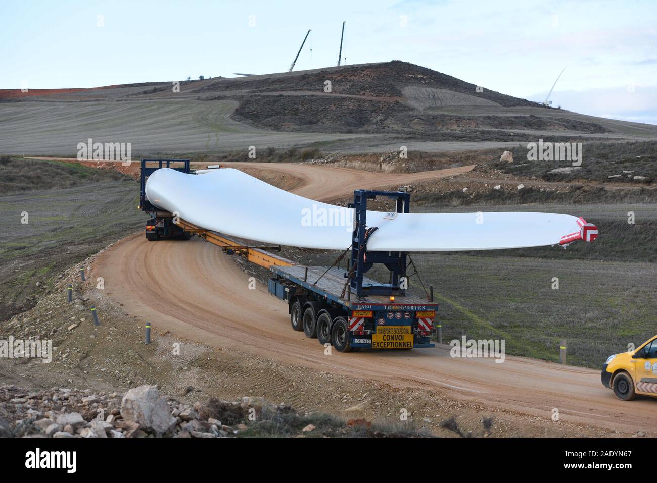 Madrid, Spain. 5th Dec, 2019. Special transport truck is seen transporting  the blade of a wind turbine near the small village of Beltejar.Construction  work continues on a new wind farm in Beltejar,