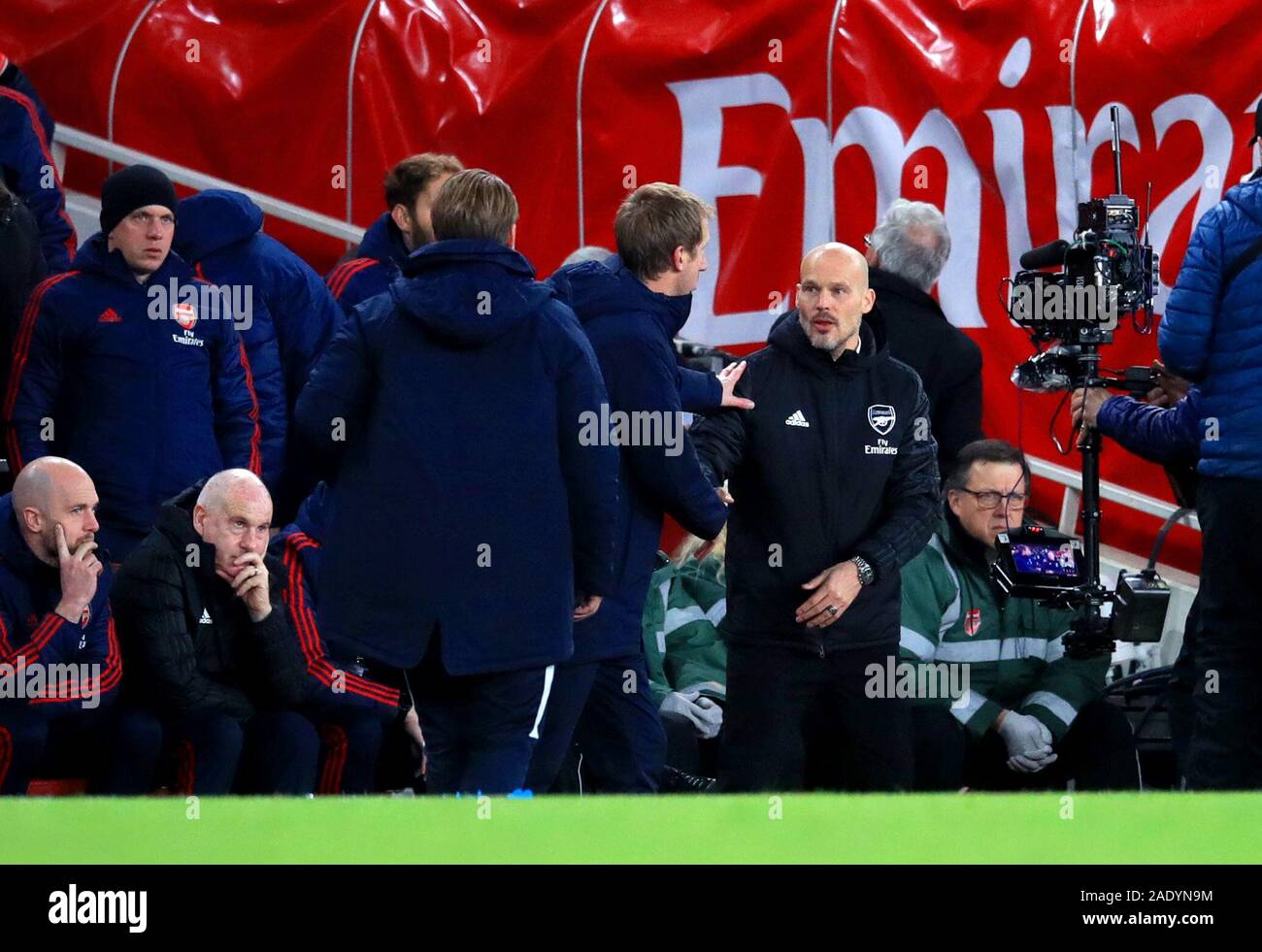 Brighton and Hove Albion manager Graham Potter (centre) shakes hands with Arsenal interim manager Freddie Ljungberg at the end of the Premier League match at the Emirates Stadium, London. Stock Photo