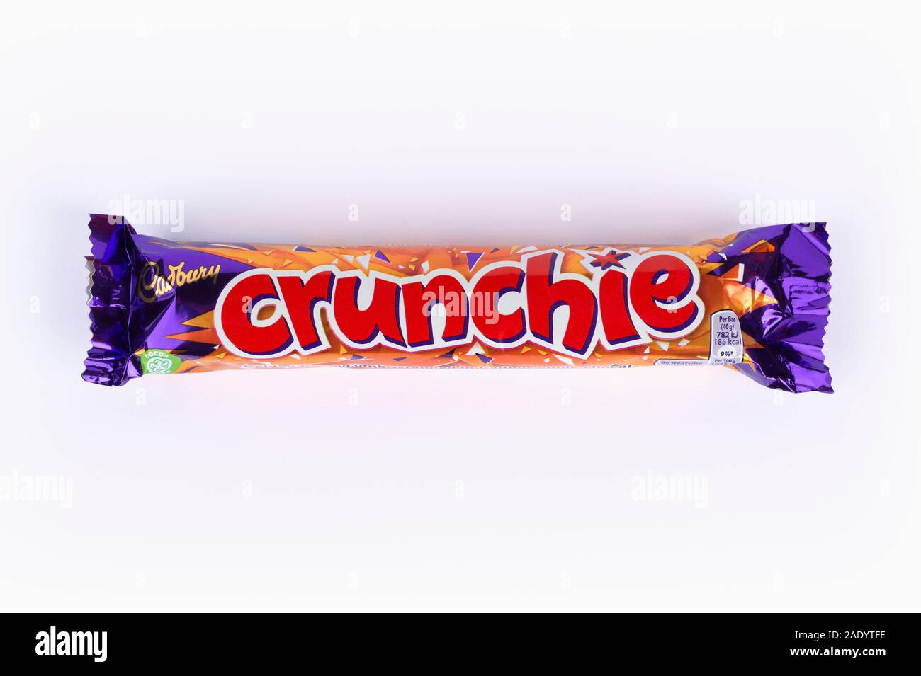 A Cadburys Crunchie chocolate bar shot on a white background. Stock Photo