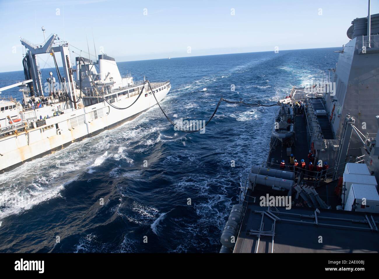 191130-N-CJ510-0144 MEDITERRANEAN SEA (Nov. 30, 2019) – Sailors aboard the Arleigh Burke-class guided-missile destroyer USS Ross (DDG 71) conduct a replenishment-at-sea with the French Durance-class command and replenishment ship FS Var (A608), Nov. 30, 2019. Ross, forward-deployed to Rota, Spain, completed its ninth patrol in the U.S. 6th Fleet area of operations in support of U.S. national security interests in Europe and Africa. (U.S. Navy photo by Mass Communication Specialist 3rd Class Andrea Rumple/Released) Stock Photo