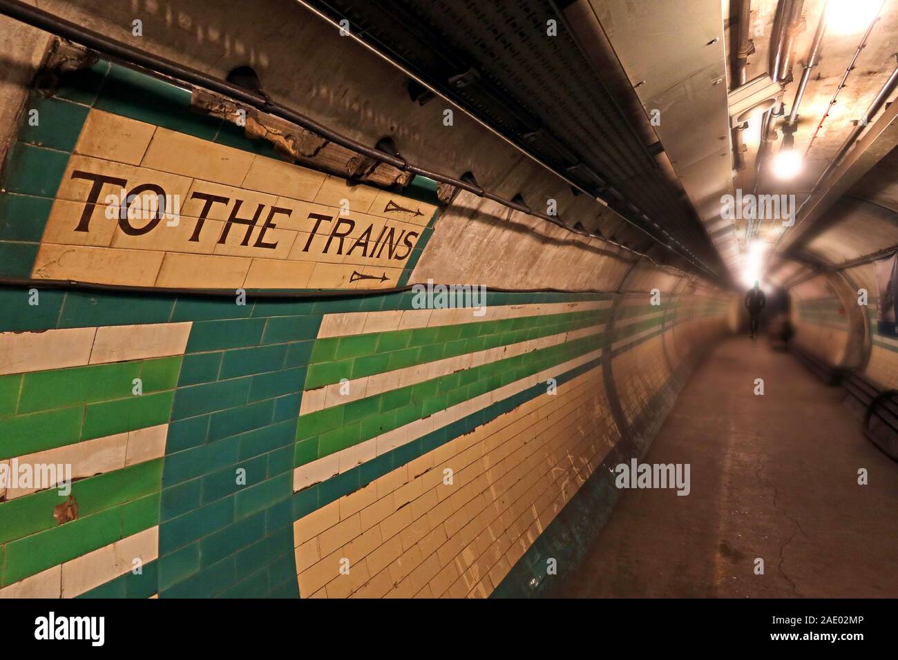To The Trains sign, London Underground Tunnel, down in the Tube Station at midnight, London, South East England, UK Stock Photo