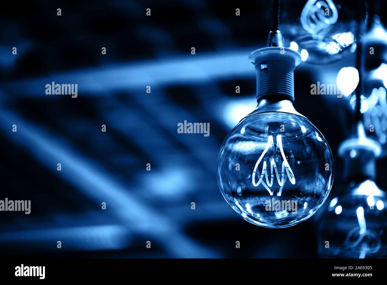 Group of blue lamps with interesting shape of tungsten filament Stock