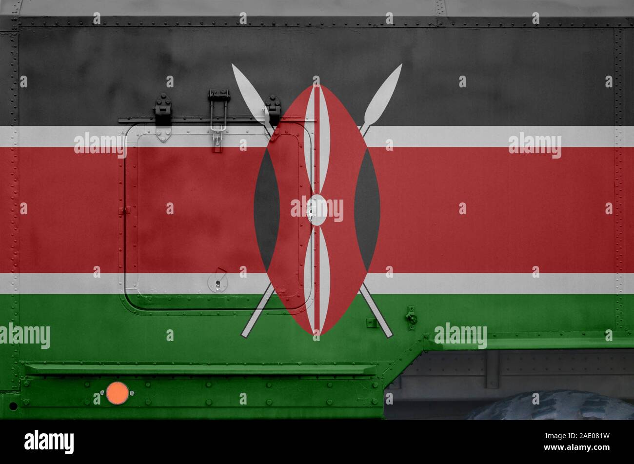 Kenya flag depicted on side part of military armored truck close up. Army forces vehicle conceptual background Stock Photo