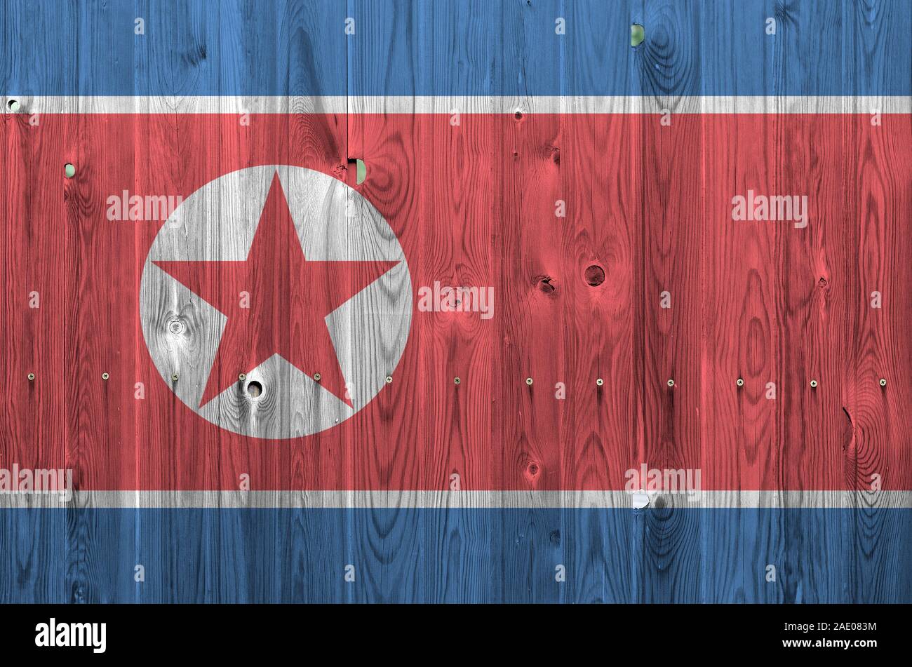 North Korea Flag Depicted In Bright Paint Colors On Old Wooden